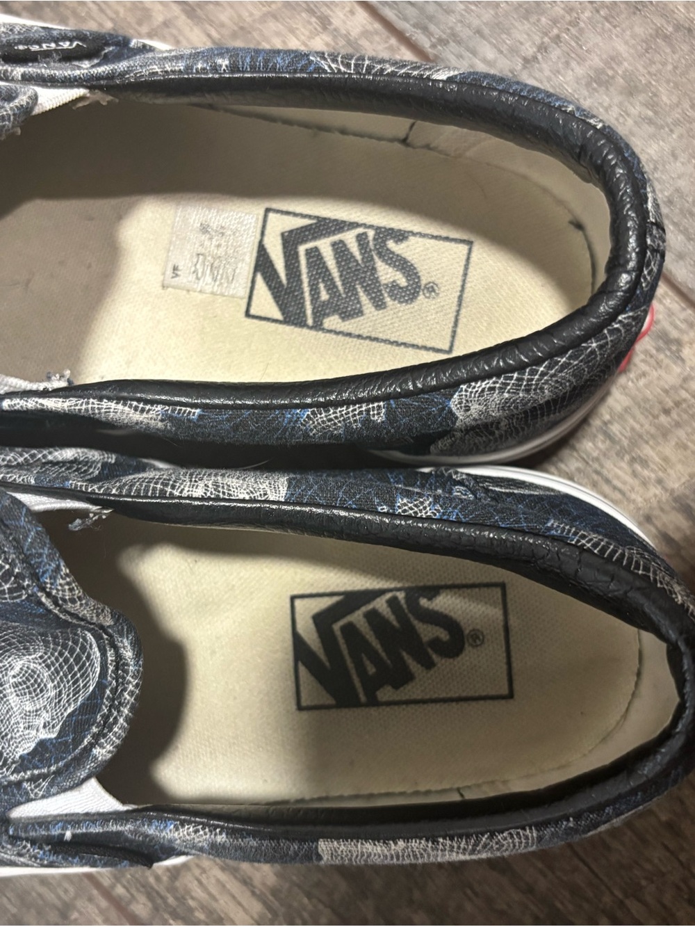 Vans Navy Slip-On Sneakers with White Wireframe Skull Pattern - Picture 2 of 5